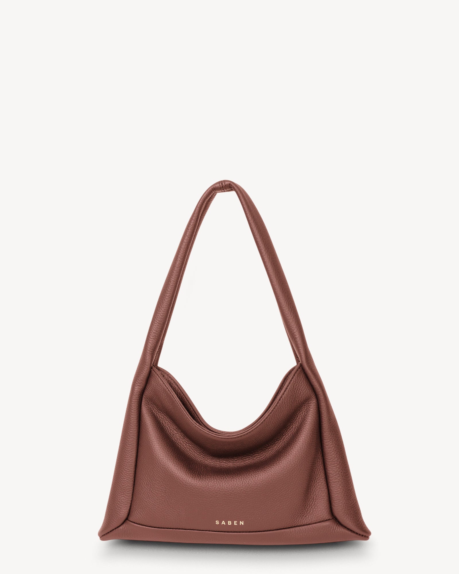 Brown handbag with 'Saks' branding on a light gray background