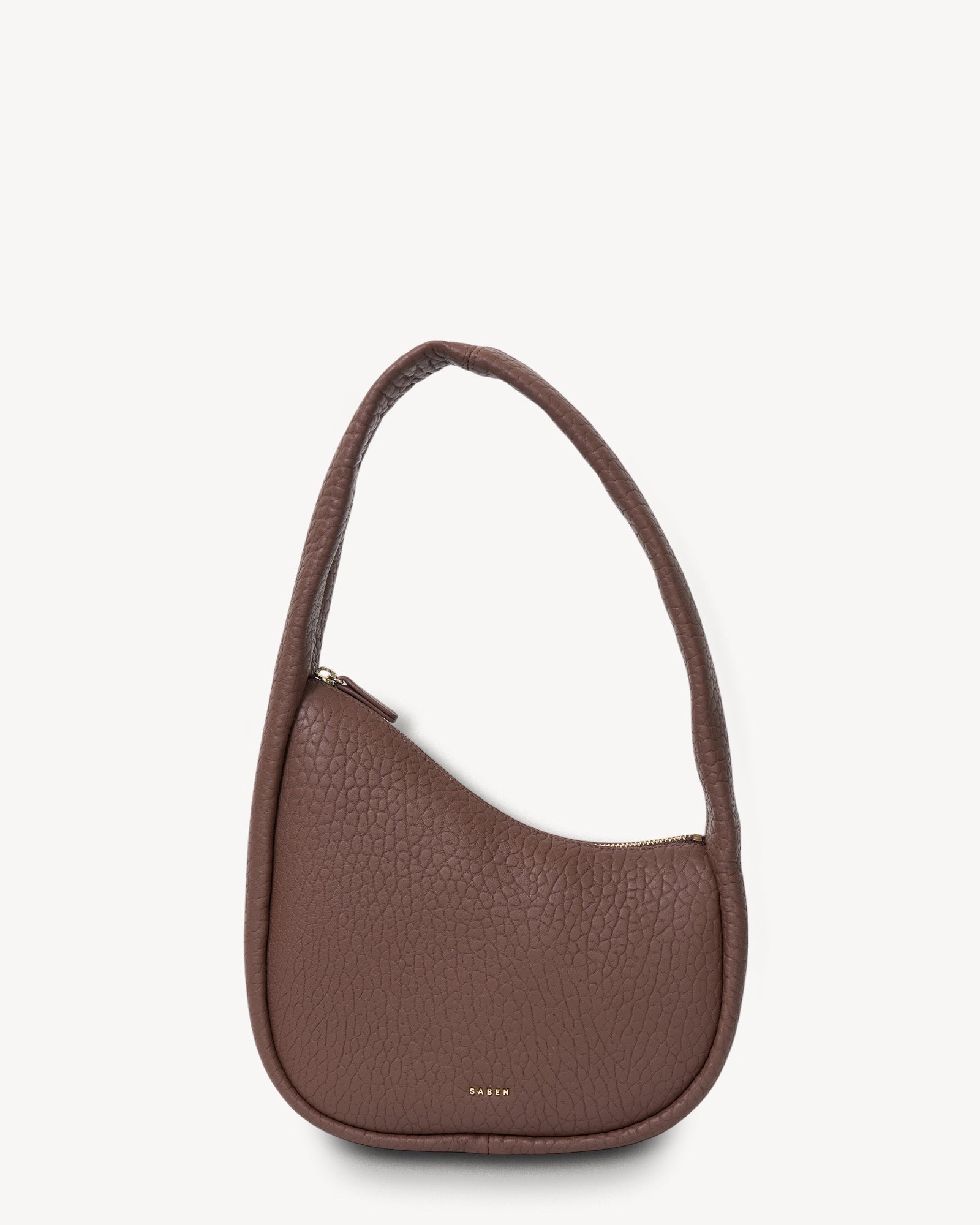 Brown handbag on a light beige background