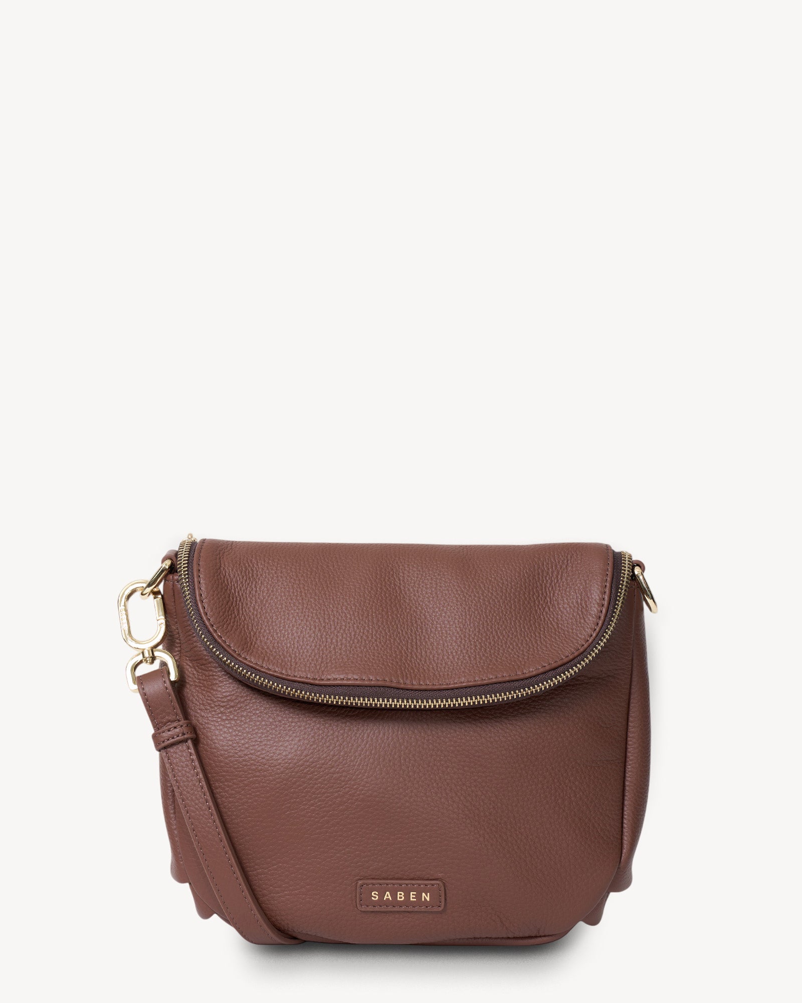 Brown leather handbag with gold zipper on a white background