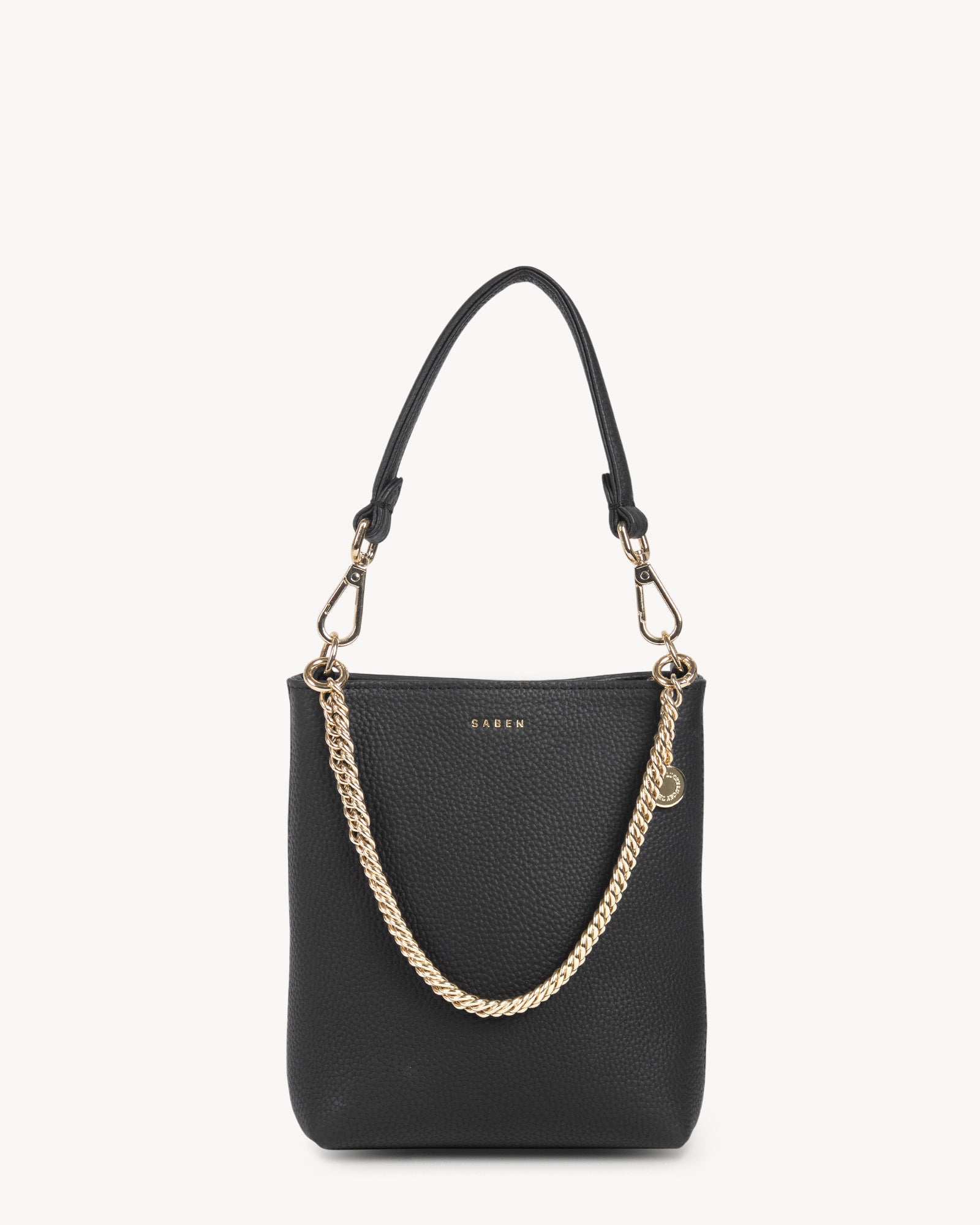 A black quilted leather handbag with a structured shape and a detachable chain strap, featuring gold hardware.