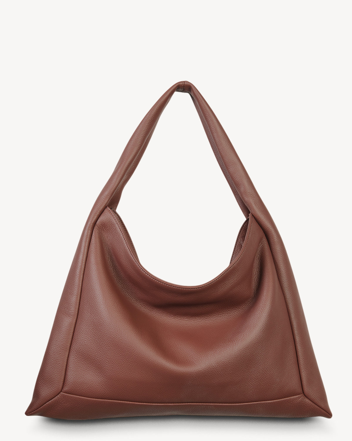 Brown leather handbag on a white background