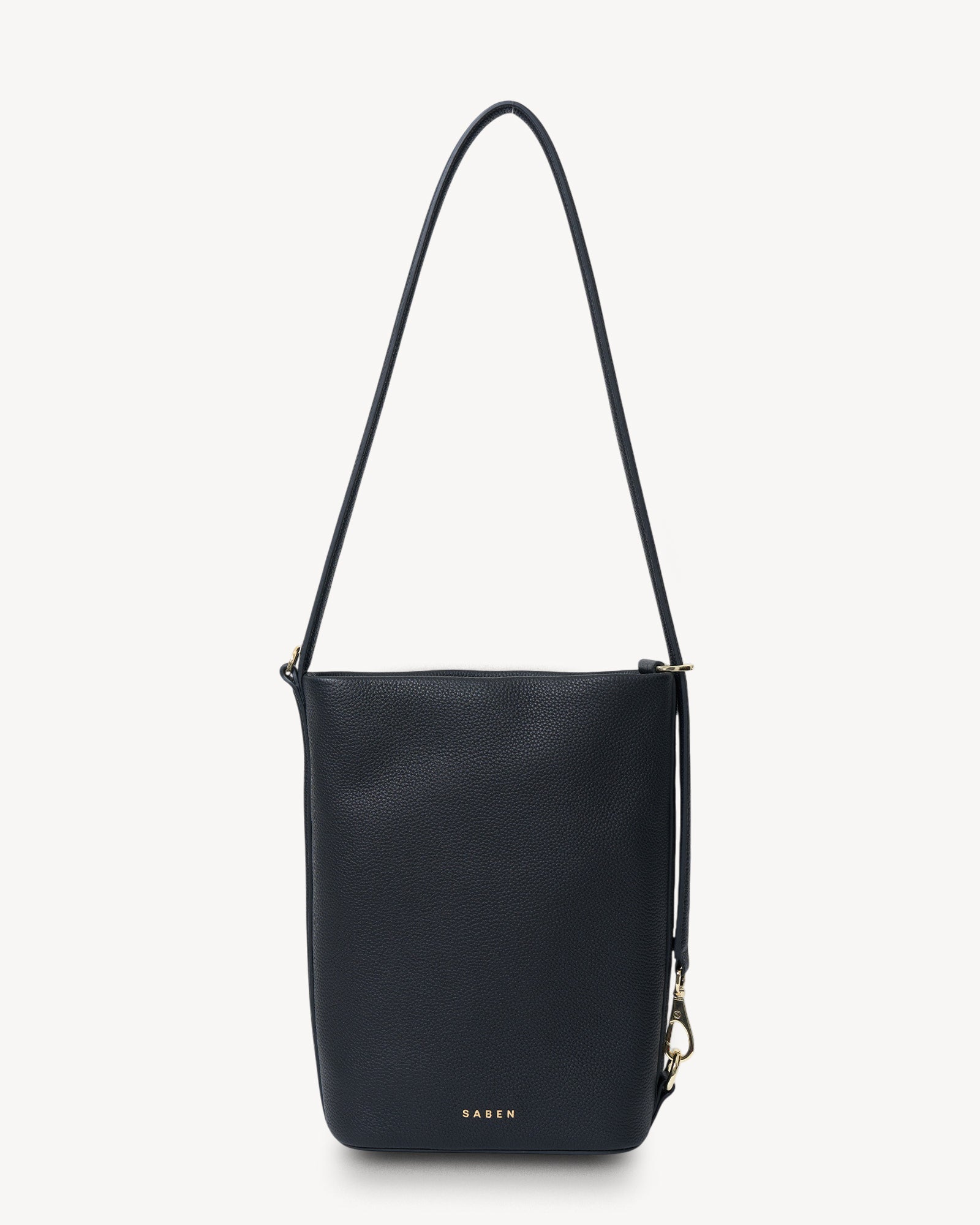 Black leather handbag with a strap on a white background