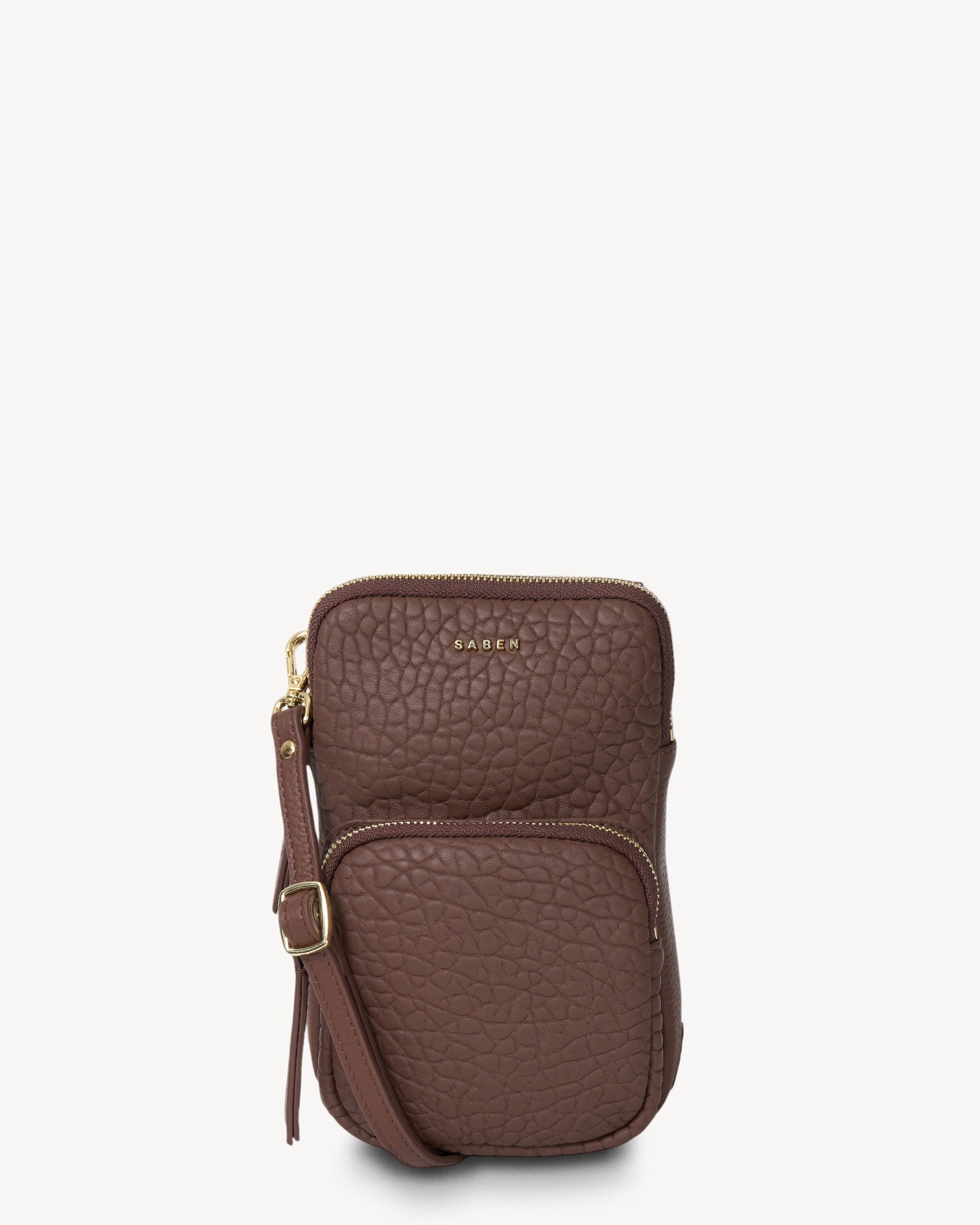 Brown leather crossbody bag with a strap on a white background