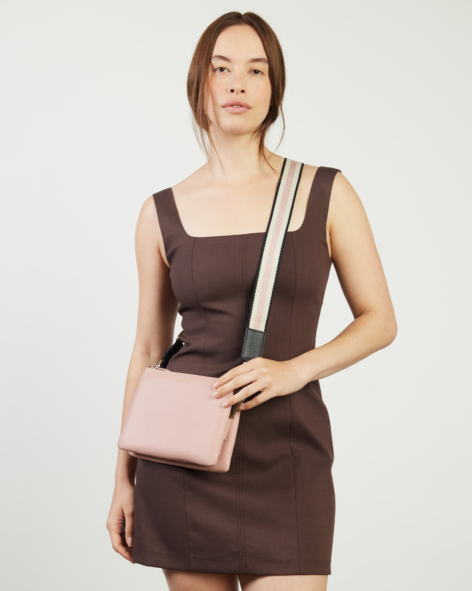 Strap with pink and white pattern on a beige background