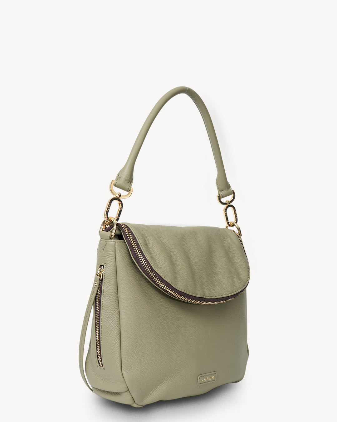 Green handbag with a shoulder strap on a white background