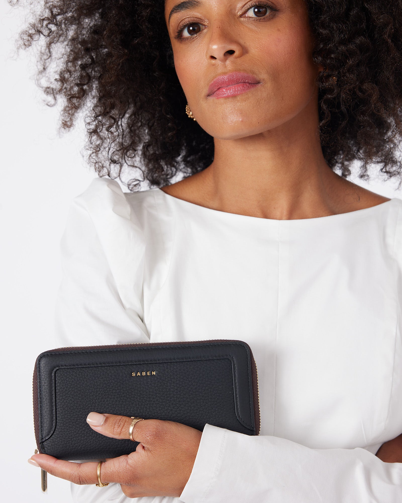Black wallet with brown accents on a white background